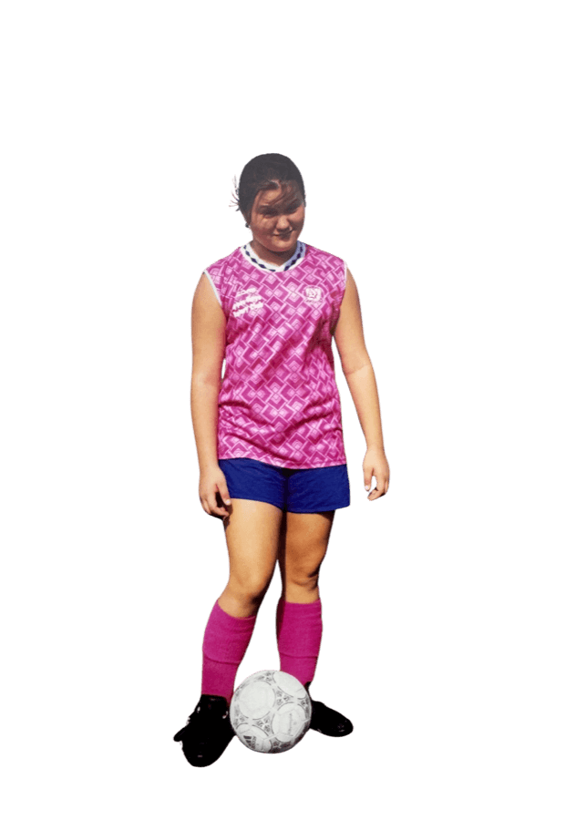 Holly as a kid, playing soccer