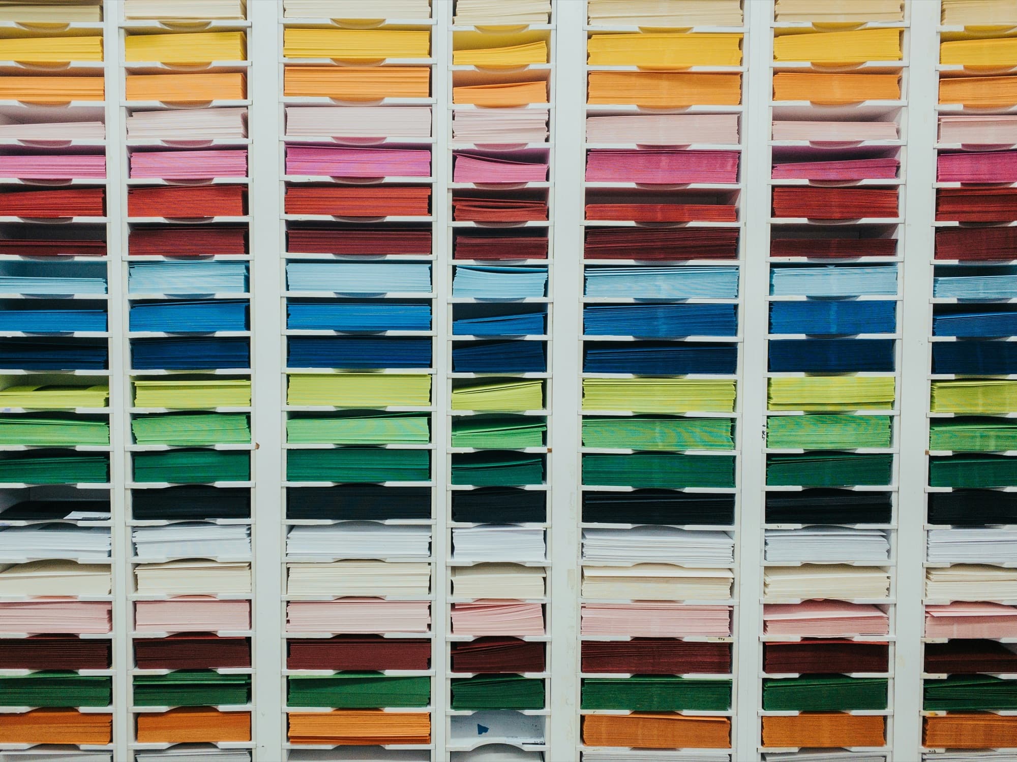Shelves of colorful organized paper